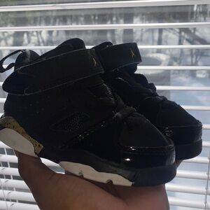 Jordan Kids Black Sneakers with Gold Highlights